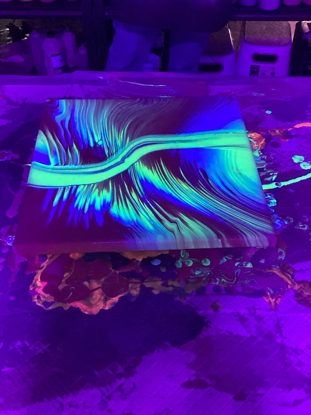 Glow in the dark fluid art under blacklight at Makers Art Studio Danville
